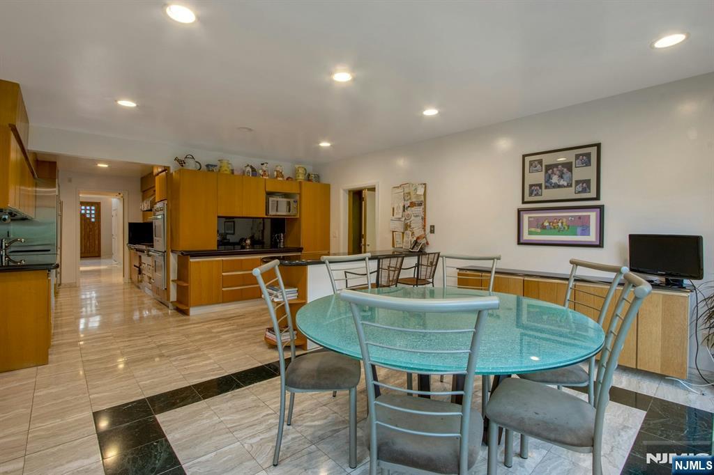 278 Fountain Road Englewood, NJ 07631 - Photo 15 of 37 a dining room with furniture and wooden floor