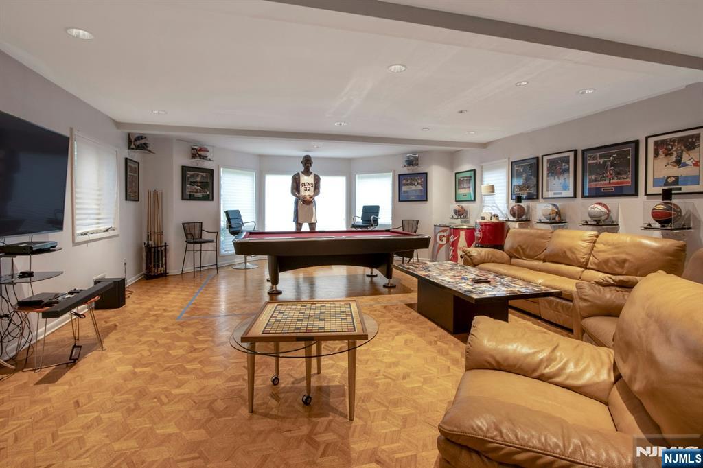 278 Fountain Road Englewood, NJ 07631 - Photo 18 of 37 a living room with furniture and a flat screen tv