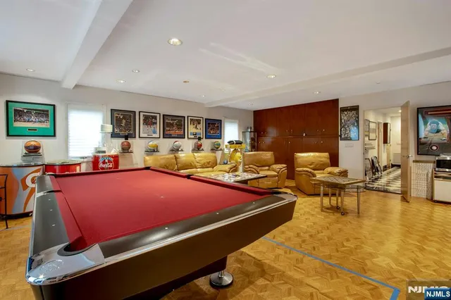 a bed room with two bed and a large mirror