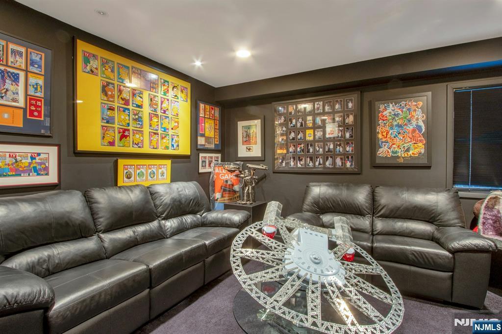 278 Fountain Road Englewood, NJ 07631 - Photo 22 of 37 a living room with furniture and a flat screen tv