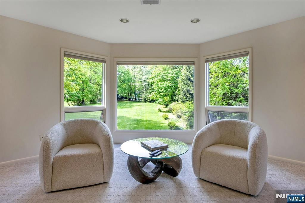 278 Fountain Road Englewood, NJ 07631 - Photo 23 of 37 a living room with furniture and a large window