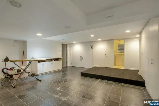 a bed room with a bed and a television