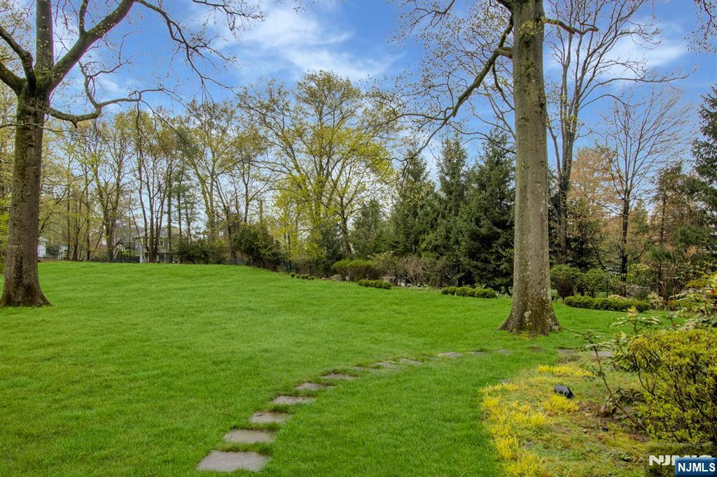 278 Fountain Road Englewood, NJ 07631 - Photo 36 of 37 a backyard of a house with lots of green space