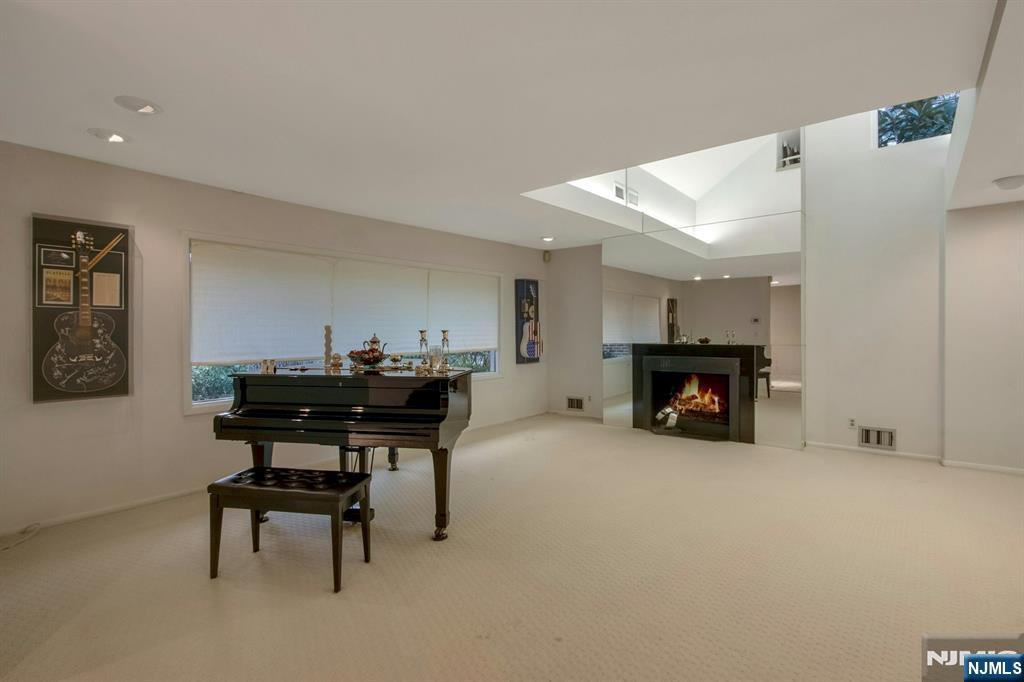 278 Fountain Road Englewood, NJ 07631 - Photo 6 of 37 a view of a livingroom with furniture and a fireplace