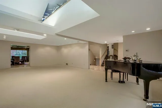 a large kitchen with lots of counter space and stainless steel appliances