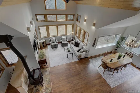 a living room with furniture tv and a flat screen tv