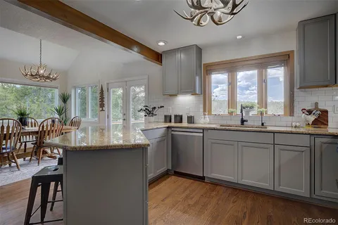 a kitchen with a table and chairs in it