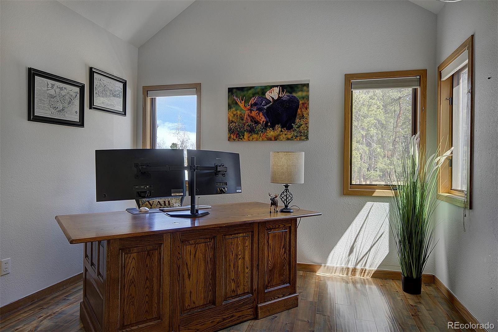 27987 Richmond Hill Road Conifer, CO 80433 - Photo 37 of 46 a workstation with a desk chair and a window