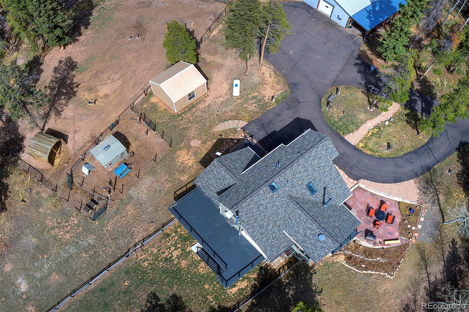 27987 Richmond Hill Road Conifer, CO 80433 - Photo 8 of 46 an aerial view of a house with a swimming pool