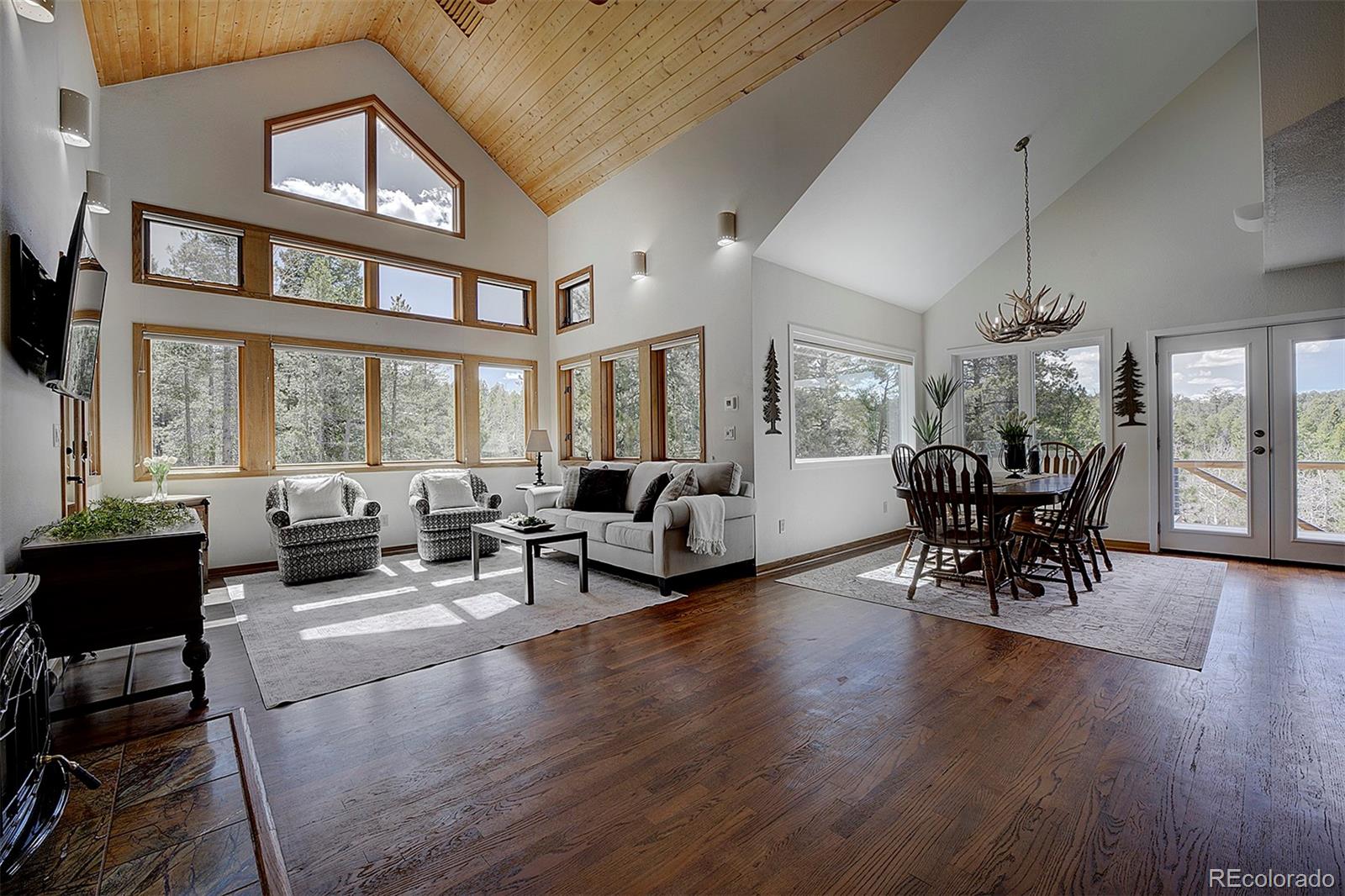 27987 Richmond Hill Road Conifer, CO 80433 - Photo 10 of 46 a living room with furniture and a large window