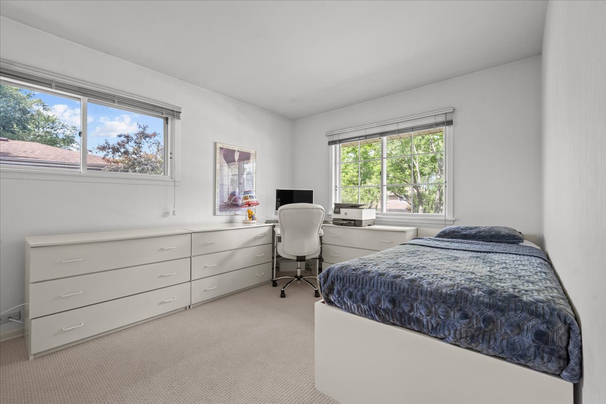 49 Larkdale E Road Deerfield, IL 60015 - Photo 12 of 24 a bedroom with a bed and wooden floor