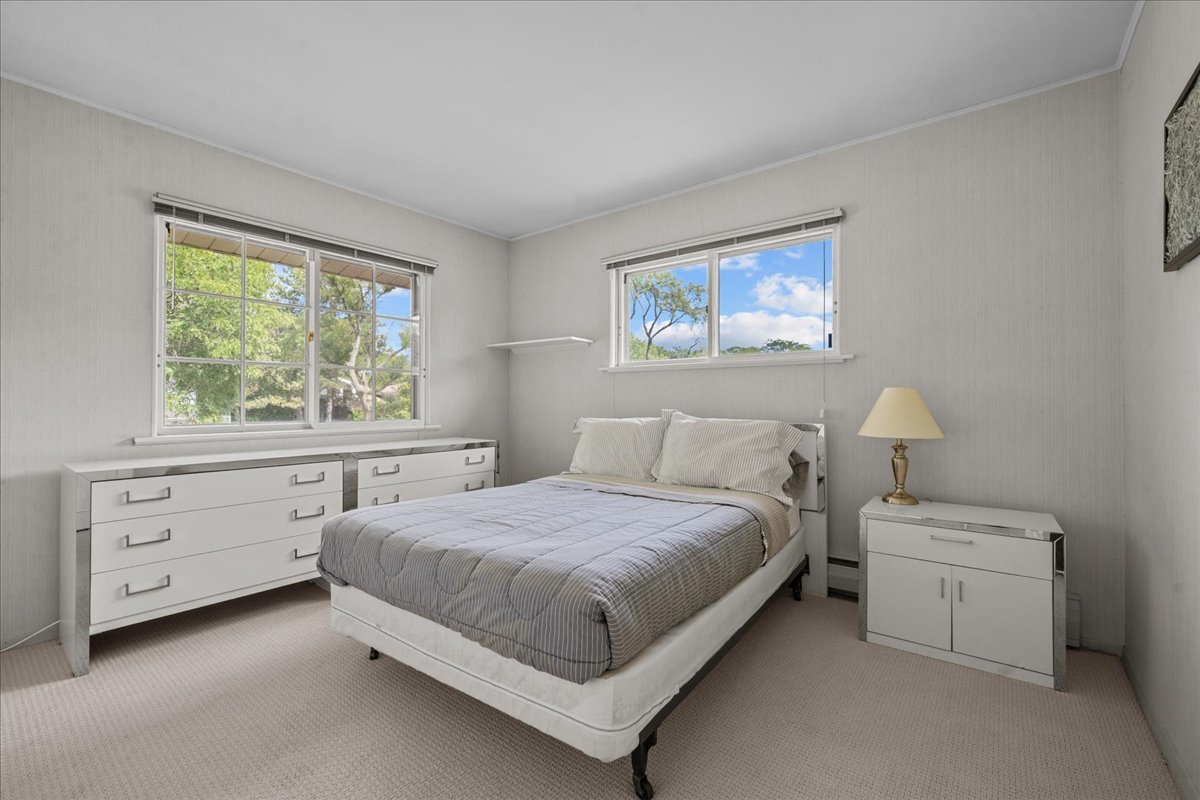49 Larkdale E Road Deerfield, IL 60015 - Photo 13 of 24 a bedroom with a bed and a window