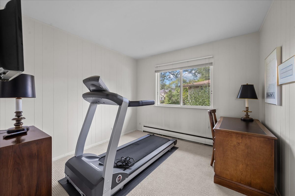 49 Larkdale E Road Deerfield, IL 60015 - Photo 14 of 24 a work room with furniture and a flat screen tv