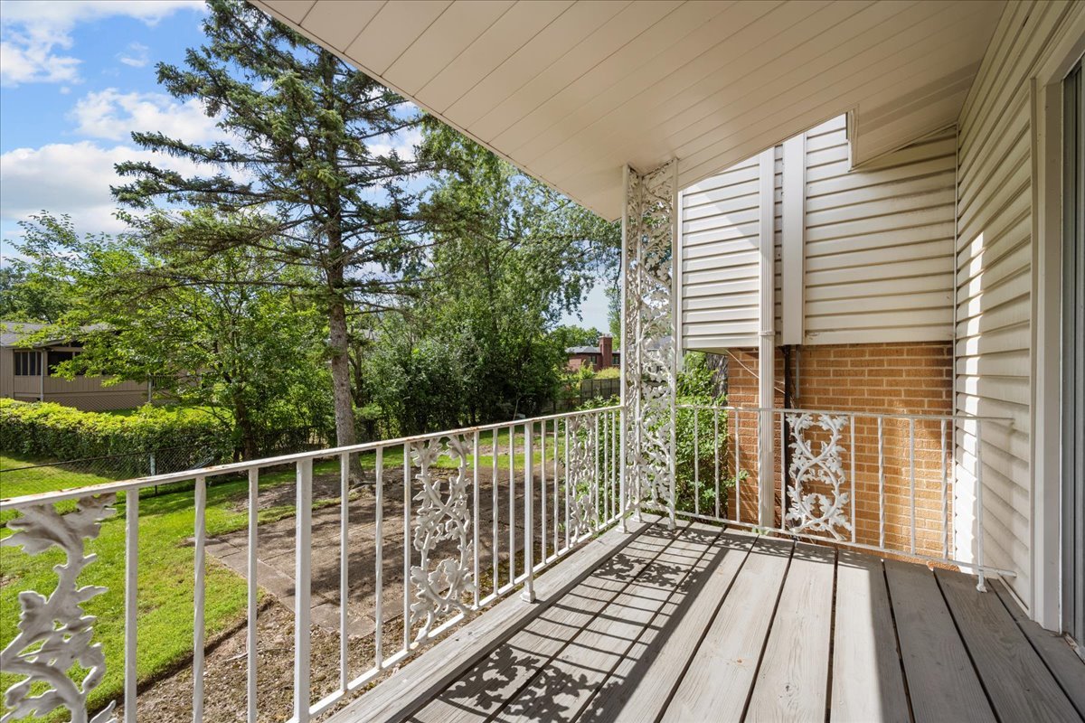 49 Larkdale E Road Deerfield, IL 60015 - Photo 17 of 24 a view of balcony with wooden floor and fence