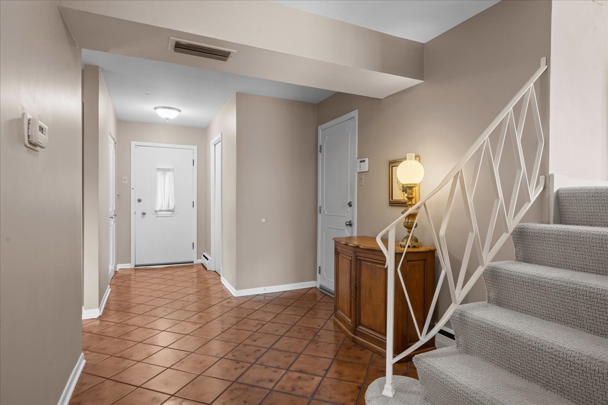 49 Larkdale E Road Deerfield, IL 60015 - Photo 2 of 24 a view of a livingroom with white furniture and stairs