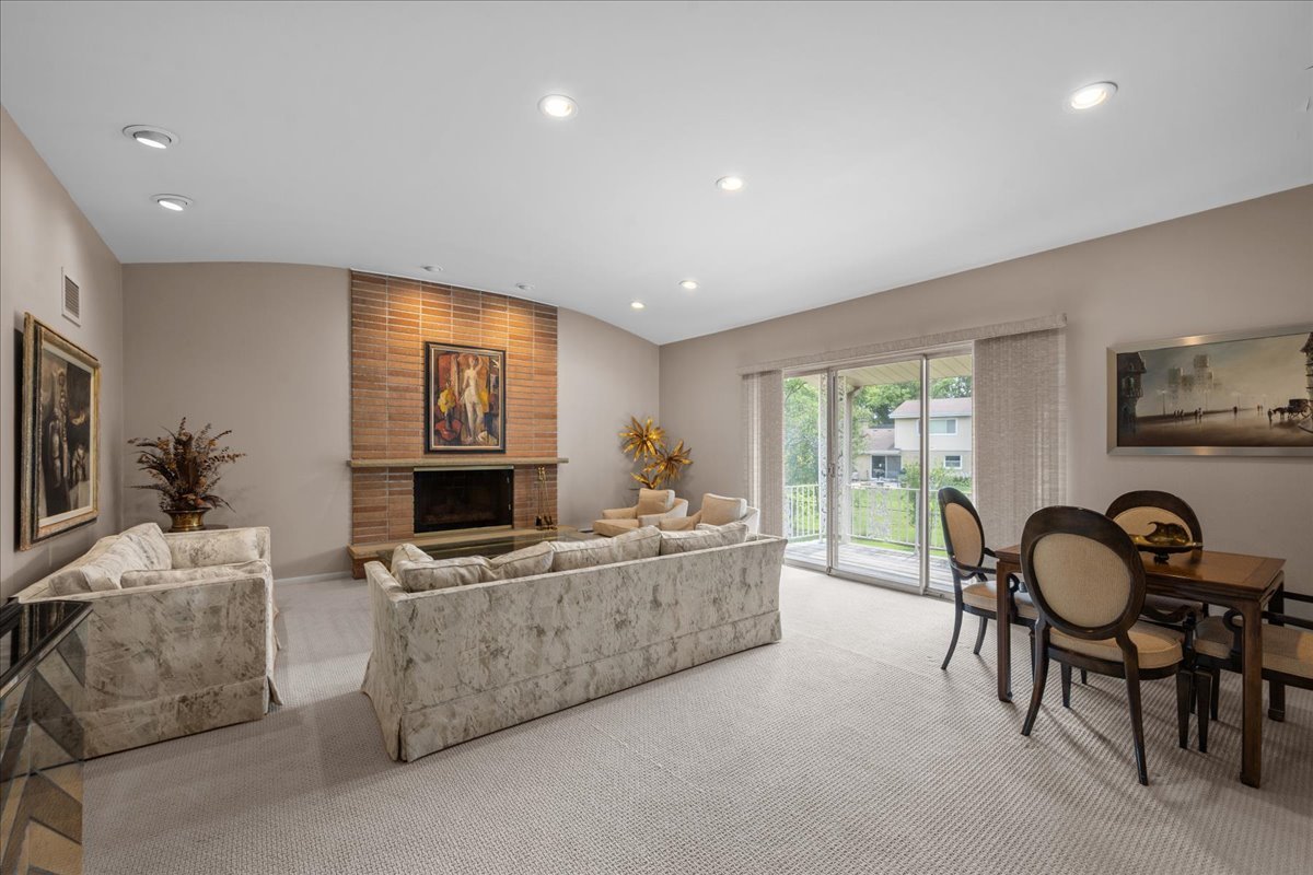 49 Larkdale E Road Deerfield, IL 60015 - Photo 7 of 24 a living room with furniture and a flat screen tv