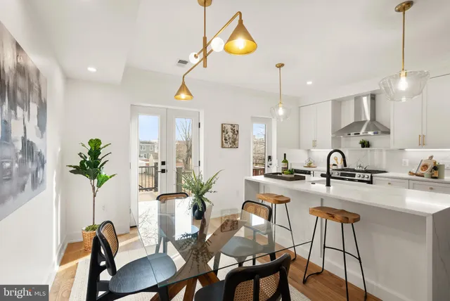 a bathroom with a sink mirror and toilet