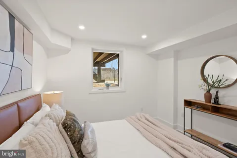 a bathroom with a shower and a sink