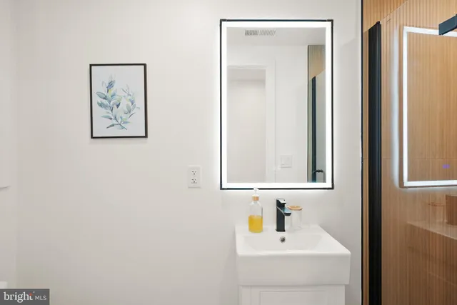 a view of a brick house with wooden floor and windows