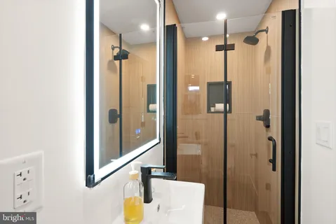 a view of a balcony with wooden floor and fence