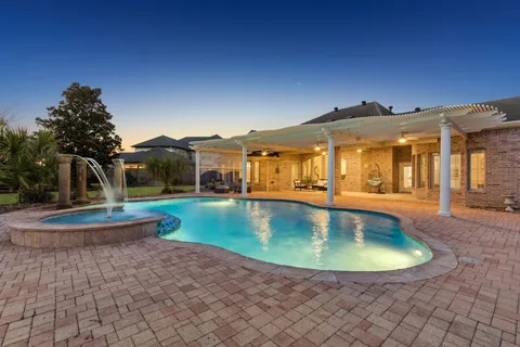a view of a house with swimming pool