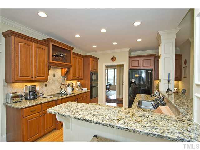 1004 Widgeon Way Raleigh, NC 27603 - Photo 12 of 25 Gorgeous high quality cabinetry, appliances and details. Many of the lower cabinets boast pull out shelves.