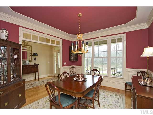 1004 Widgeon Way Raleigh, NC 27603 - Photo 16 of 25 Impressive Dining Room with lovely trey ceiling detail and transom windows along with wainscot. Very elegant, yet cozy.