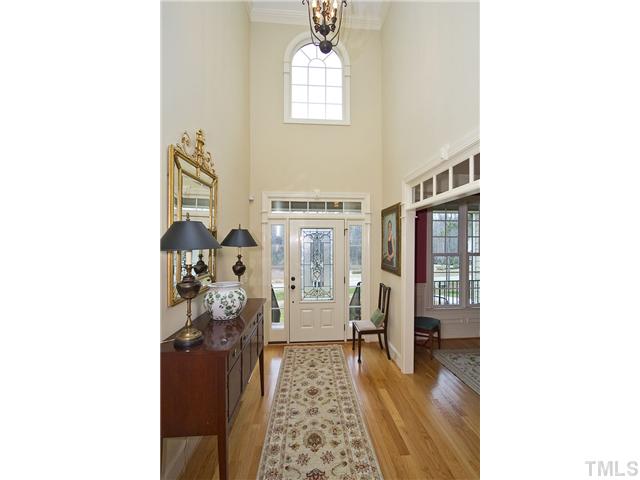 Impressive open foyer with transom window details.
