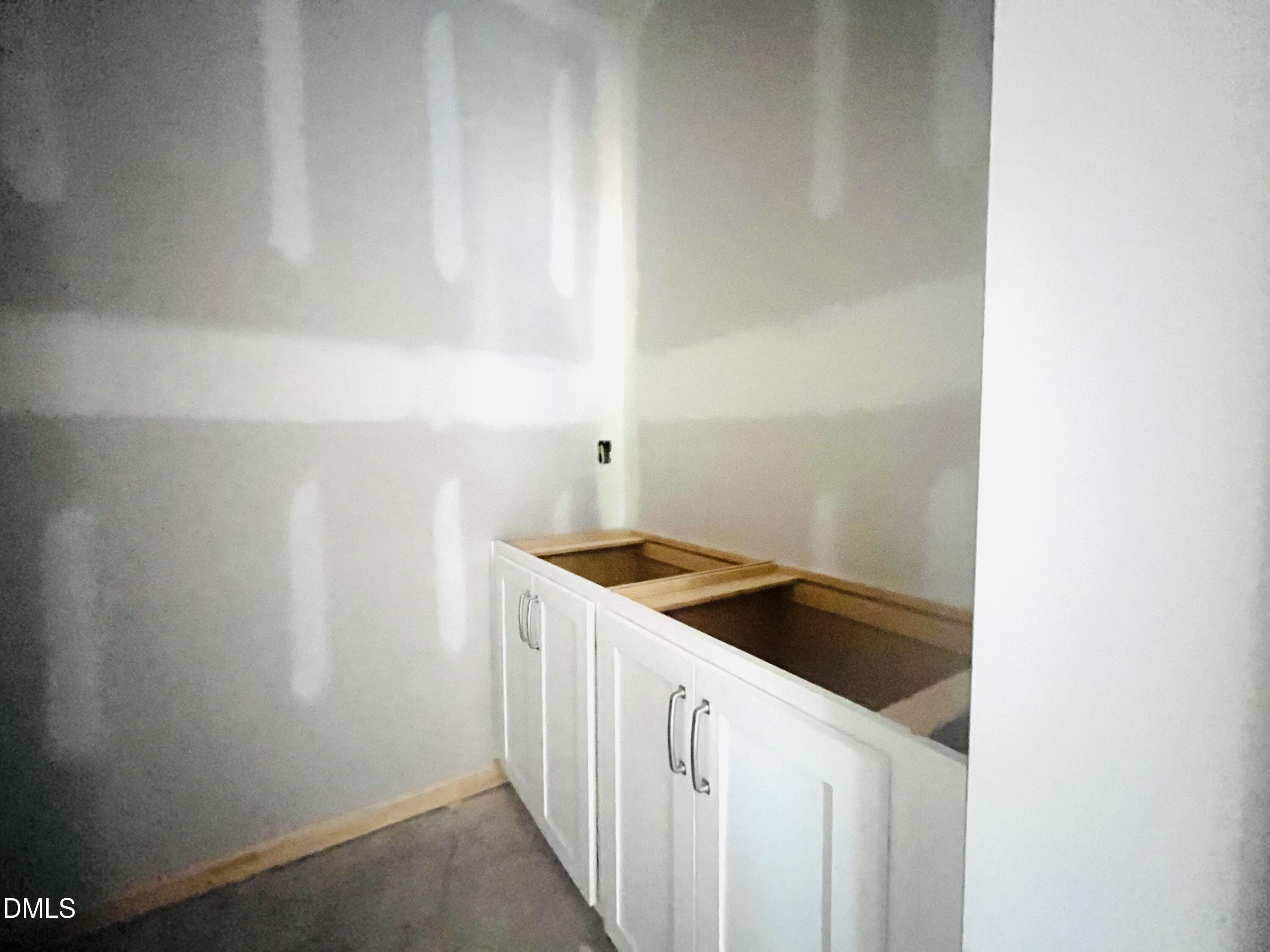 11695 Salers Loop Middlesex, NC 27557 - Photo 23 of 29 a kitchen with a sink and cabinets