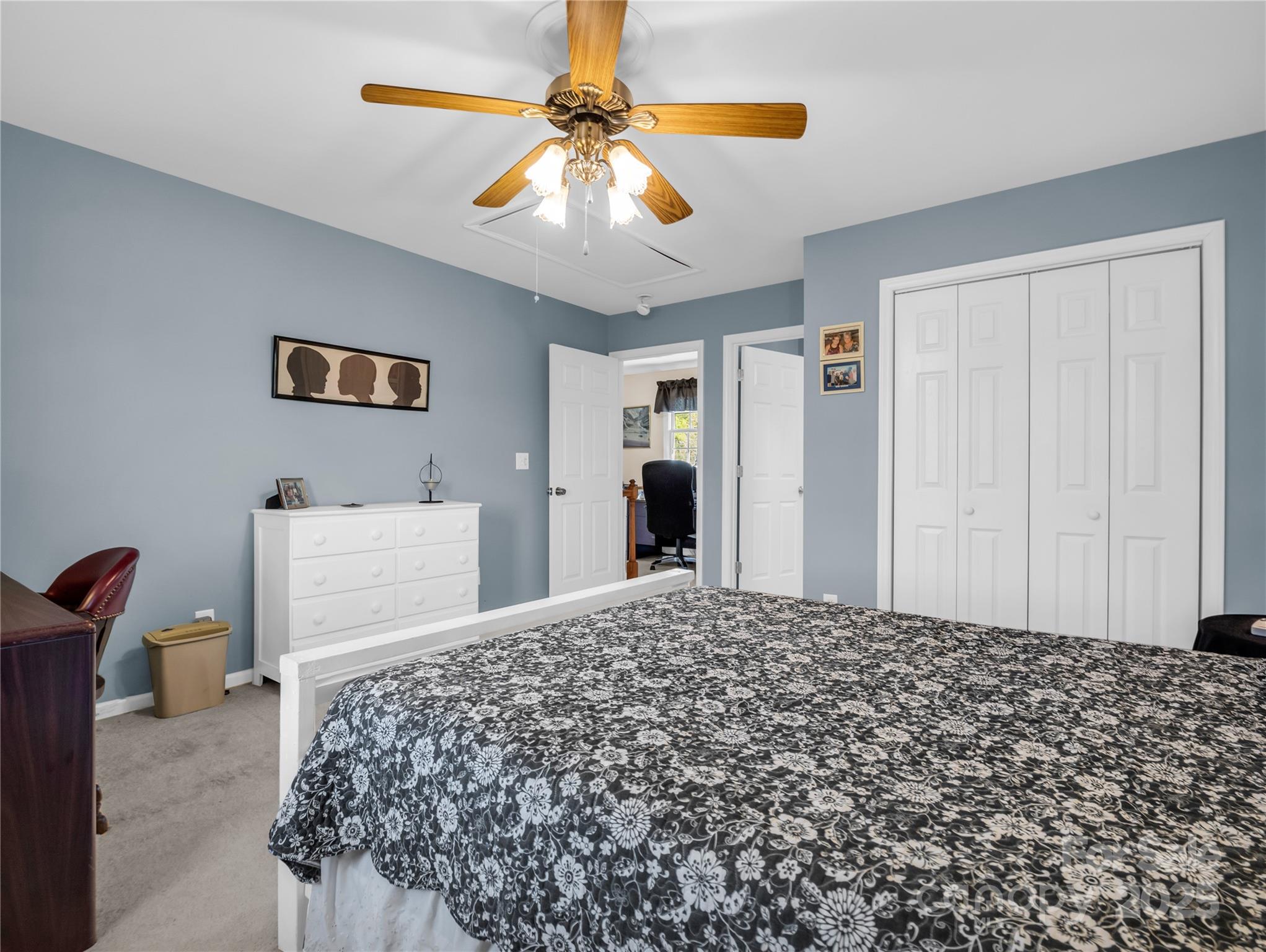 6873 Poors Ford Road Rutherfordton, NC 28139 - Photo 23 of 46 a bedroom with a bed and a chandelier