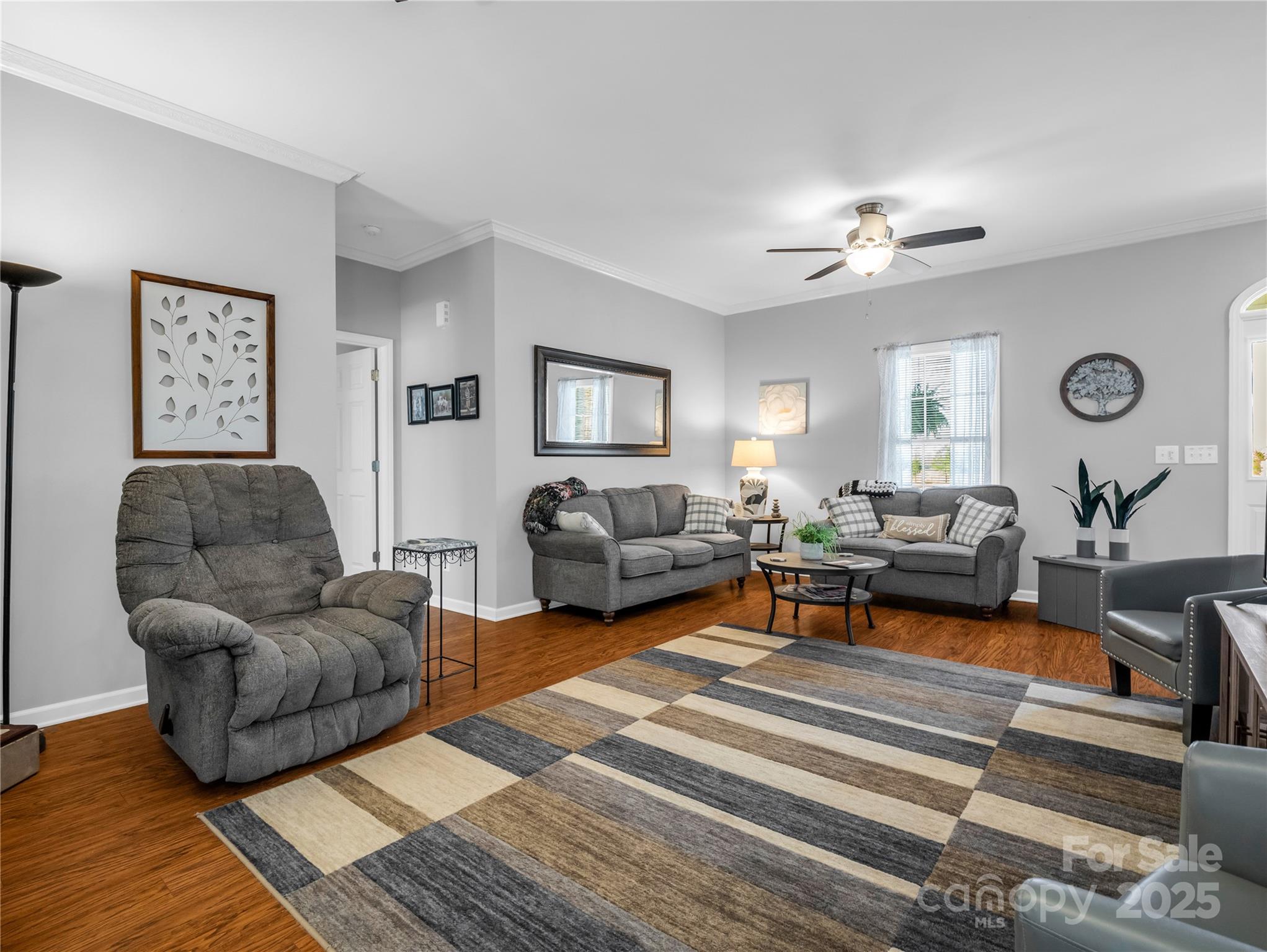 6873 Poors Ford Road Rutherfordton, NC 28139 - Photo 3 of 46 a living room with furniture a rug and wall paintings