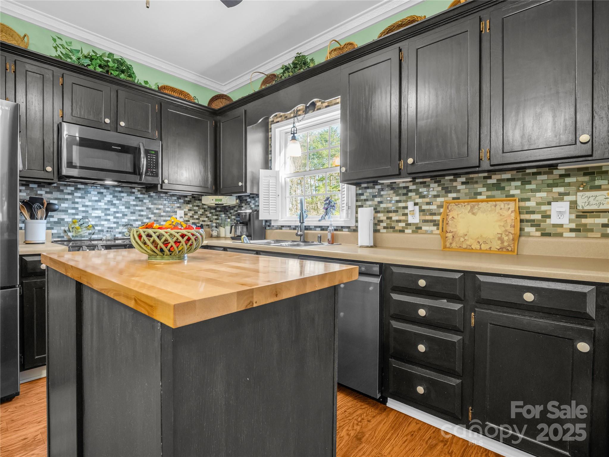 6873 Poors Ford Road Rutherfordton, NC 28139 - Photo 6 of 46 a kitchen with stainless steel appliances granite countertop a sink stove and cabinets