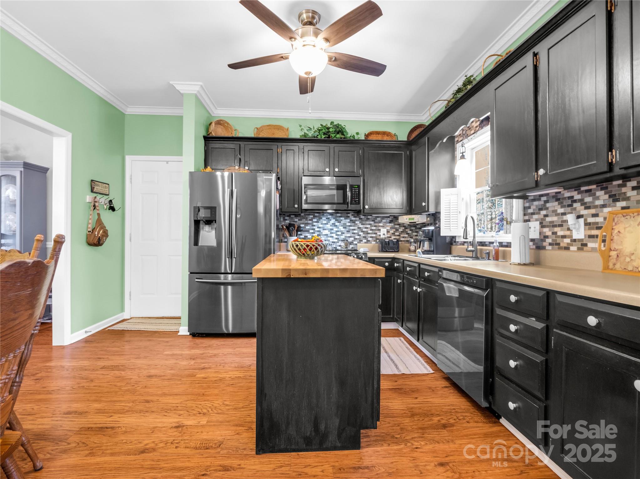 6873 Poors Ford Road Rutherfordton, NC 28139 - Photo 7 of 46 a kitchen with stainless steel appliances granite countertop a refrigerator a stove and a sink