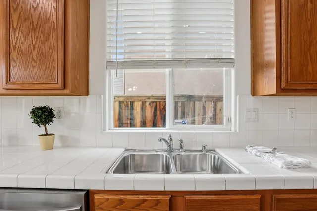 a kitchen with a sink and a window