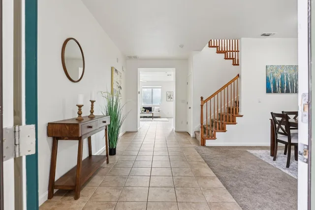 a view of a room with wooden floor and windows