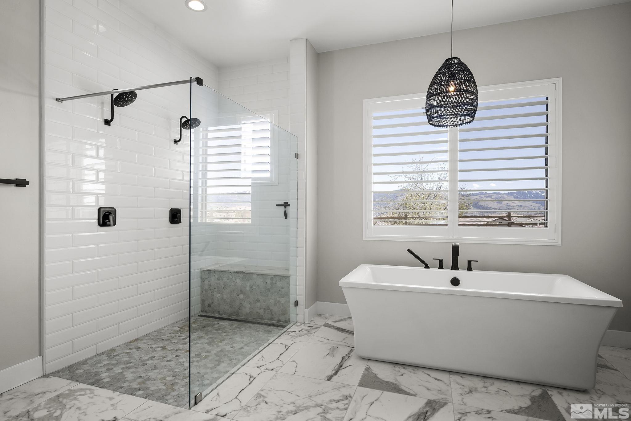 13326 Travertine Lane Reno, NV 89511 - Photo 14 of 36 a white bath tub sitting next to a window