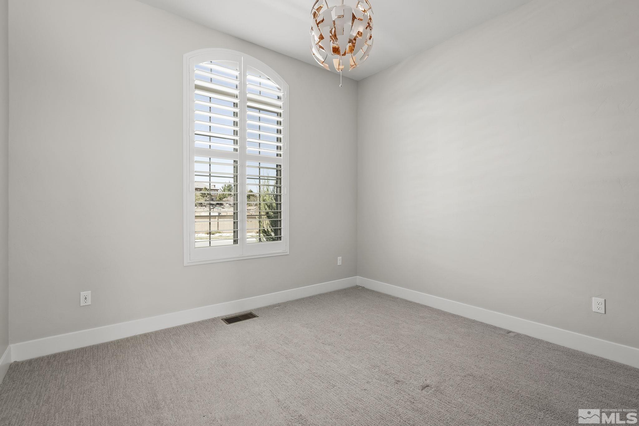 13326 Travertine Lane Reno, NV 89511 - Photo 17 of 36 an empty room with a window