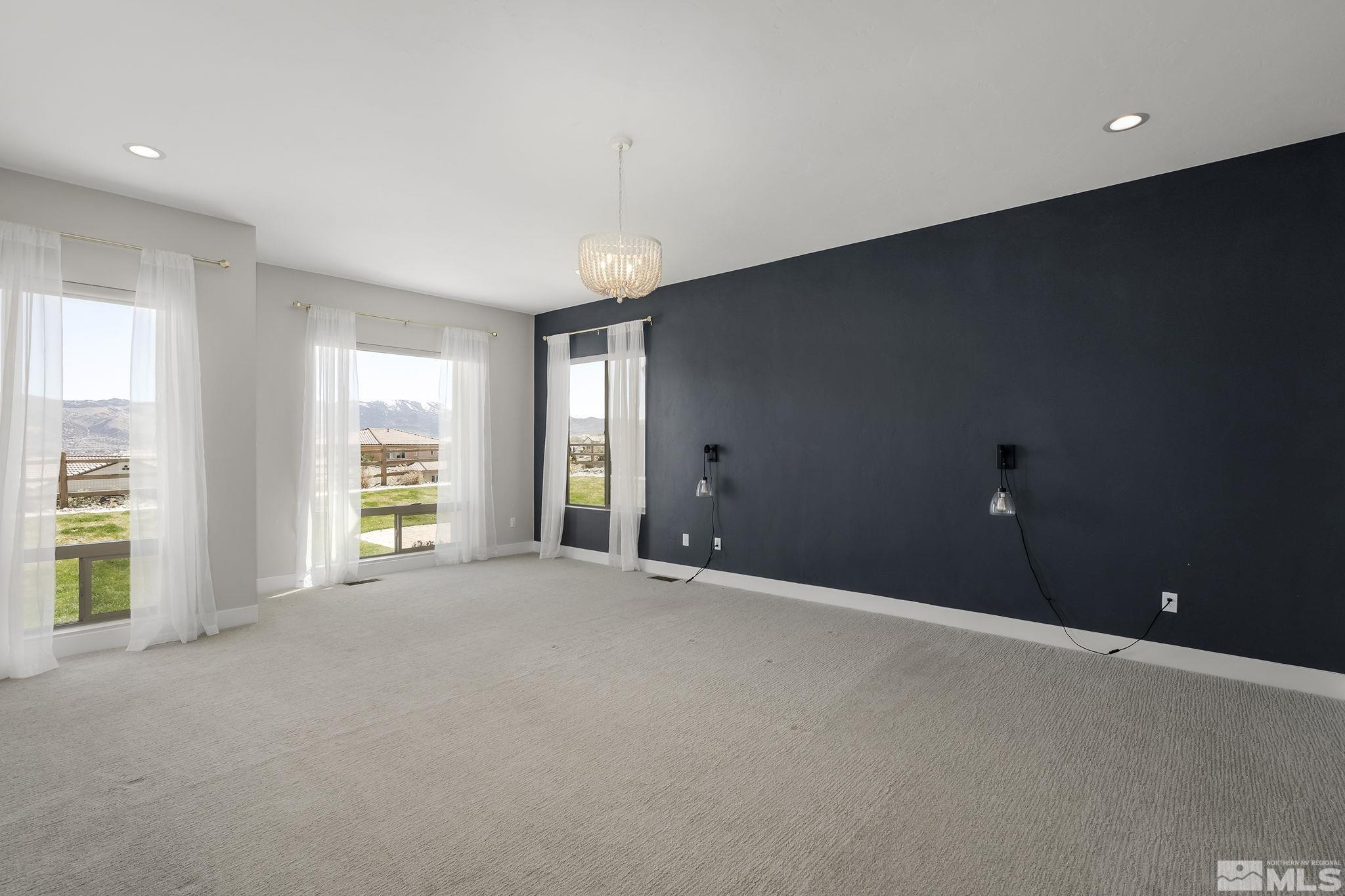 13326 Travertine Lane Reno, NV 89511 - Photo 19 of 36 a view of an empty room with a window