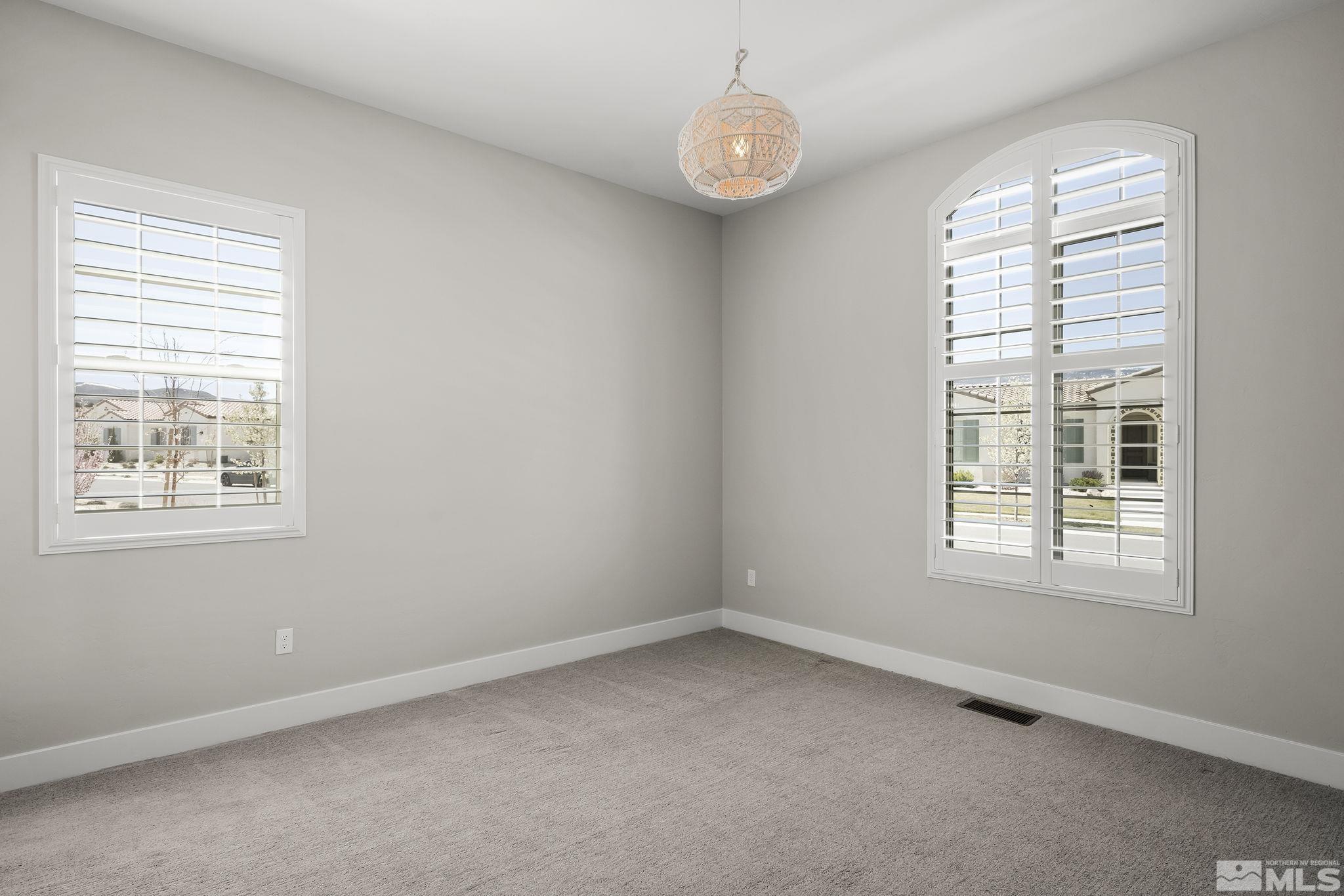 13326 Travertine Lane Reno, NV 89511 - Photo 23 of 36 an empty room with a window