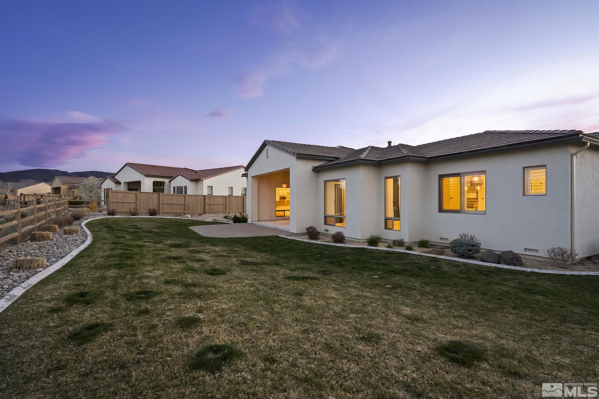 13326 Travertine Lane Reno, NV 89511 - Photo 30 of 36 a front view of a house with a yard