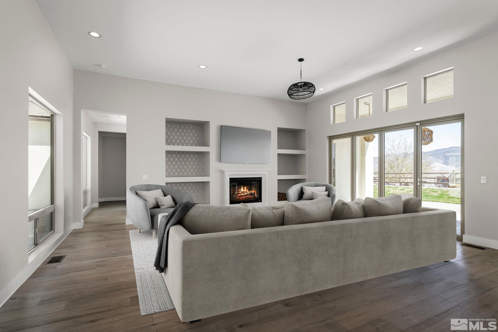 13326 Travertine Lane Reno, NV 89511 - Photo 3 of 36 a living room with furniture and a fireplace