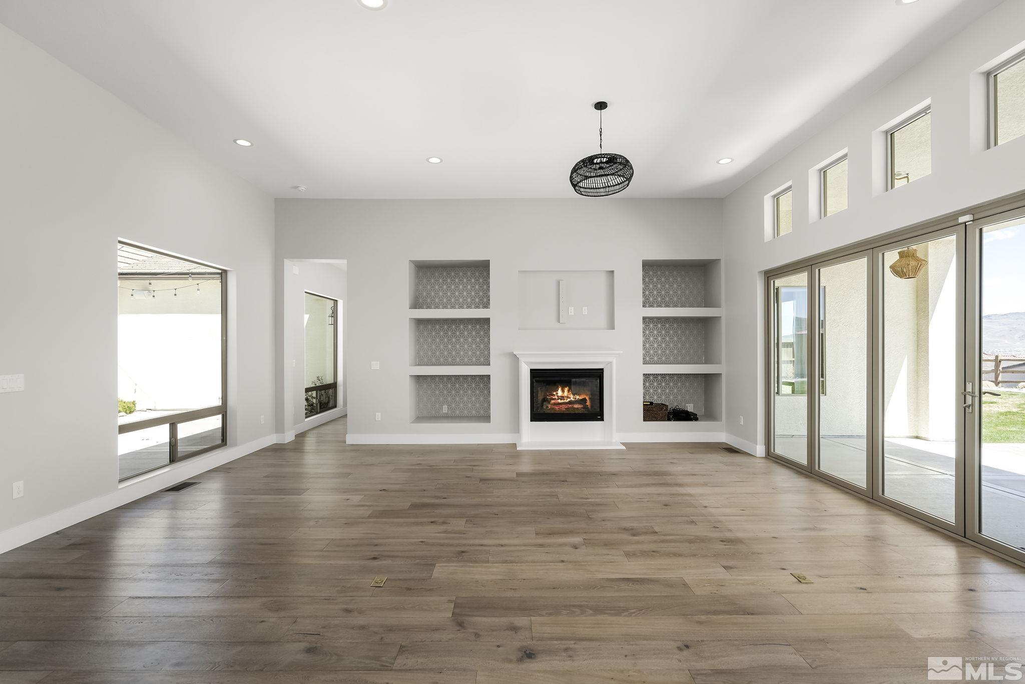 13326 Travertine Lane Reno, NV 89511 - Photo 8 of 36 a view of an empty room with window and fire place
