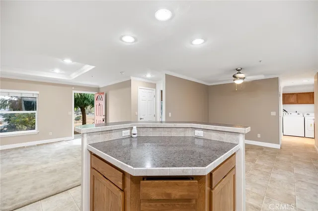 a kitchen with a sink vanity and window