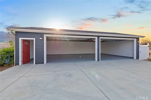 a view of a backyard with large trees