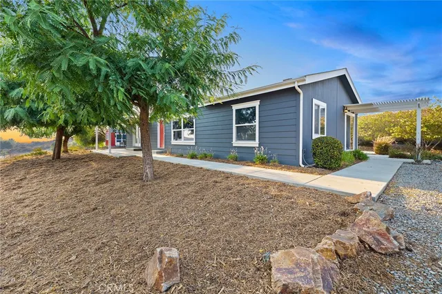 an aerial view of a house with a mountain view