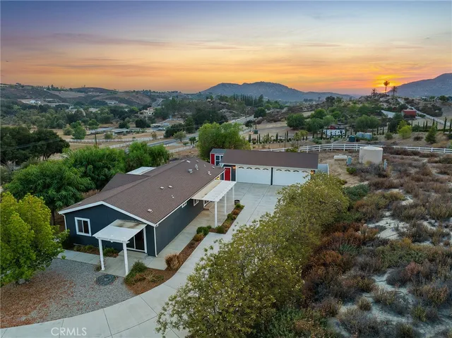 an aerial view of a house with a garden
