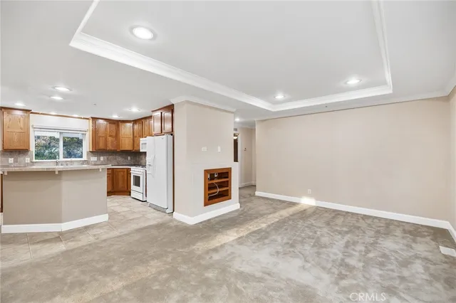 a view of a kitchen with a sink and cabinets