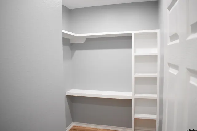 a view of an empty walk in closet