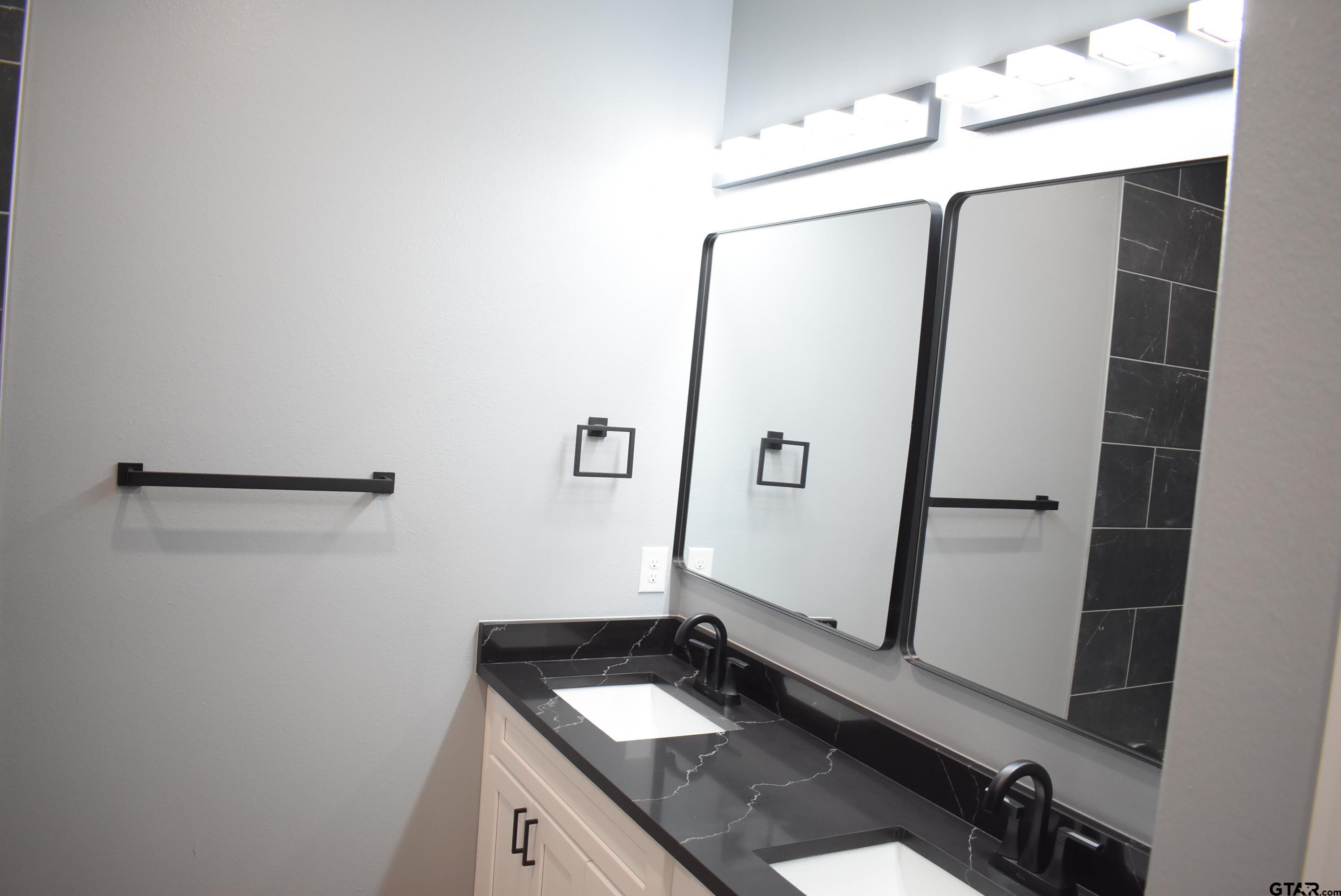 162 Ruby Lane Nacogdoches, TX 75965 - Photo 15 of 44 a bathroom with a sink and mirror