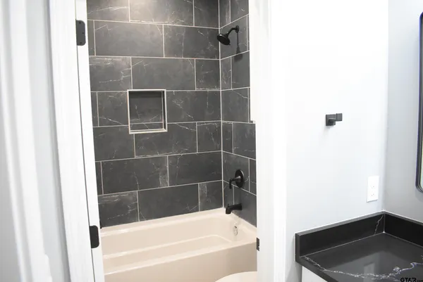 a bathroom with a bathtub